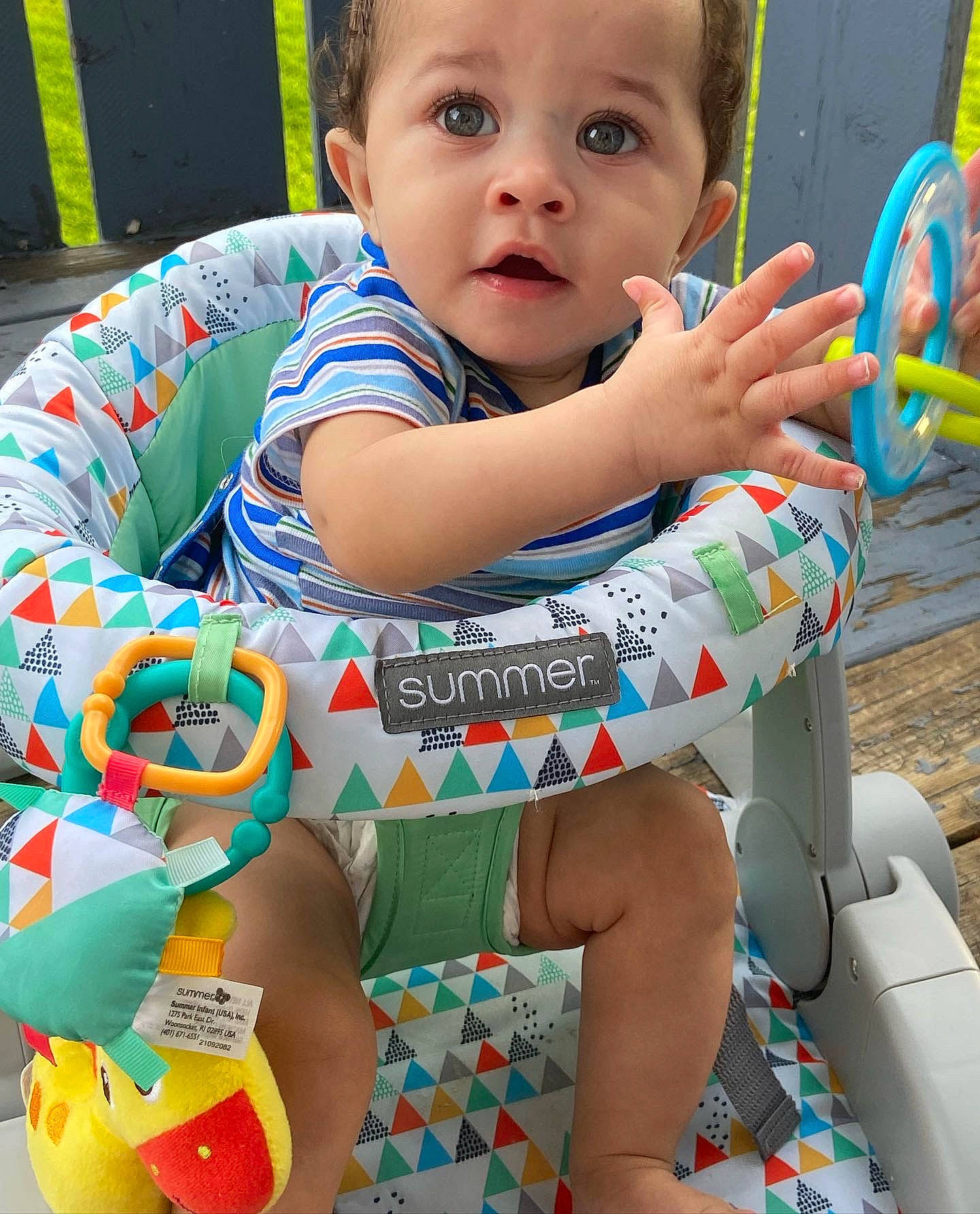Davon joined the competition — help win amazing prizes! baby, baby_playing_with_toys, baby_toddler_clothing, child, face, fun, green, happy, head, iris, leisure, pattern, person, product, sitting, skin, sleeve, surprise, thigh, toddler