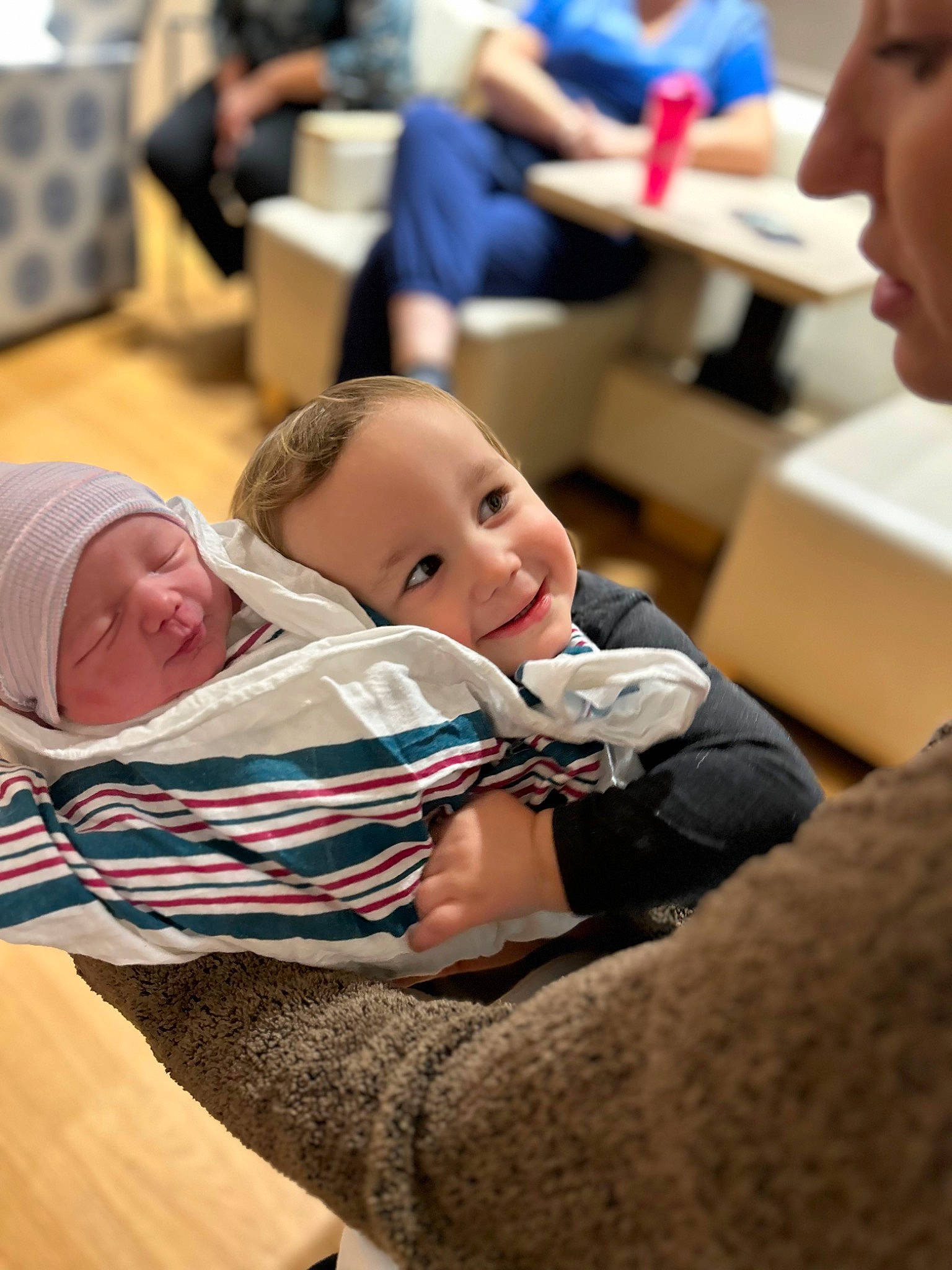 Ada is registered to the contest to win money with this photo: baby, chair, child, comfort, couch, event, flooring, fun, happy, headwear, human, interaction, joy, learning, leisure, person, room, sitting, table, toddler