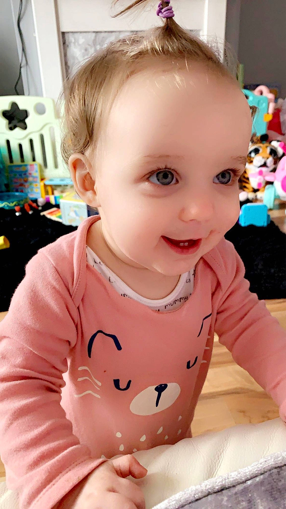 Faye is registered to the contest to win money with this photo: baby, baby_toddler_clothing, cheek, chin, eye, eyebrow, facial_expression, hairstyle, happy, head, iris, lip, mouth, nose, person, pink, product, skin, sleeve, smile
