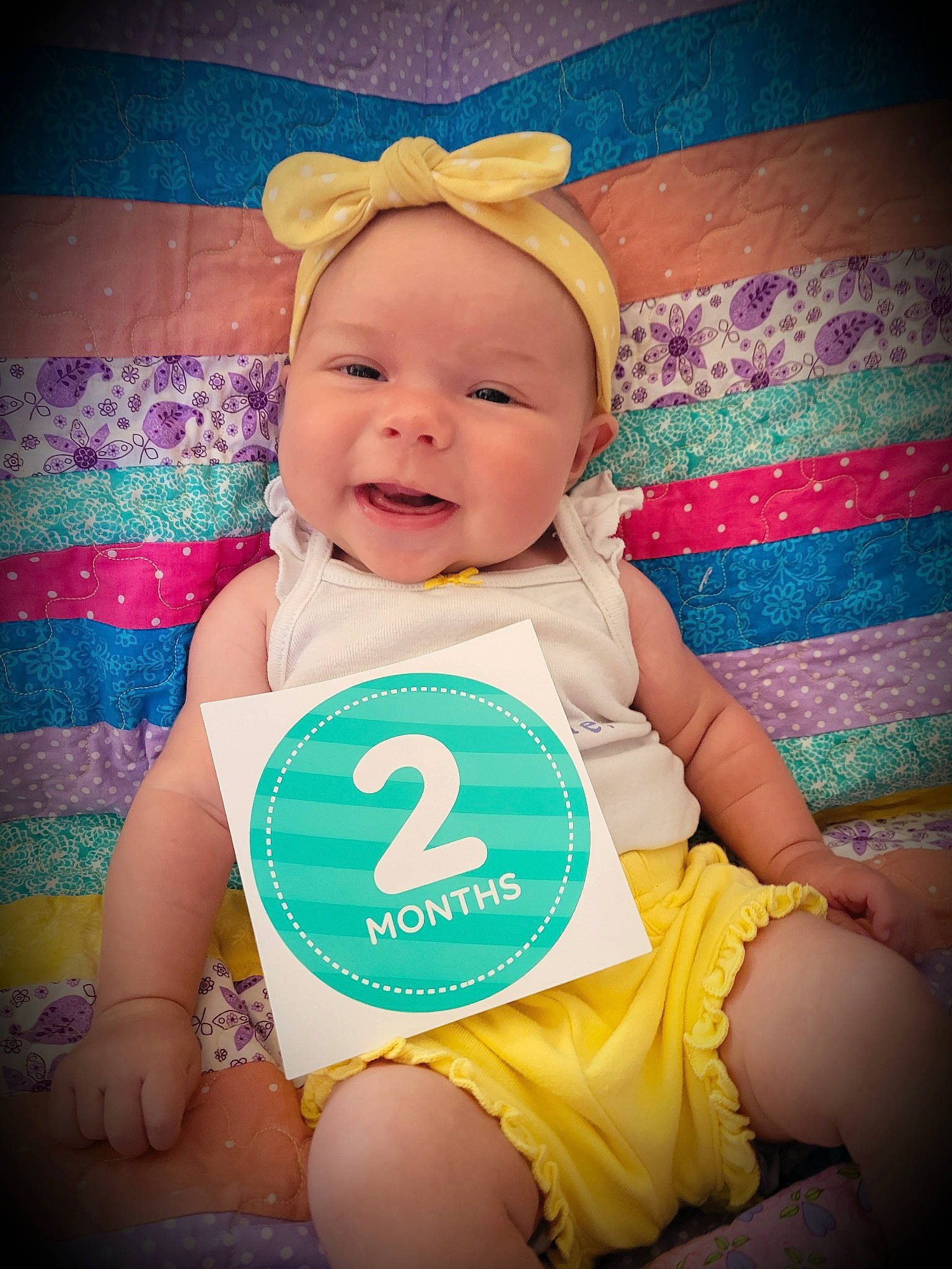 Maggie Mae is registered to the contest to win money with this photo: aqua, baby, baby_laughing, baby_sleeping, baby_toddler_clothing, beauty, cap, cheek, child, cool, finger, flash_photography, happy, headwear, iris, person, pink, product, skin, smile