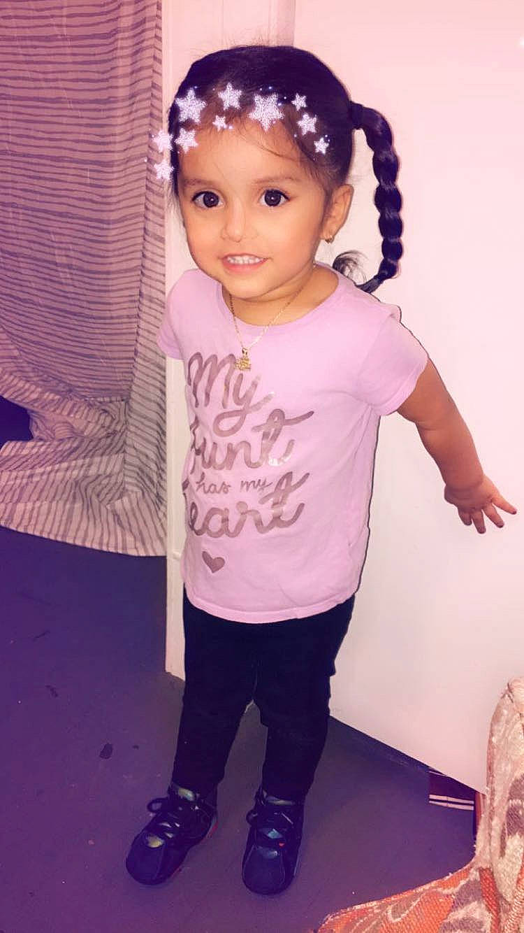 Kamiya is registered to the contest to win money with this photo: cheek, child, child_model, ear, eye, face, forehead, hair, hair_accessory, hairstyle, head, iris, joy, person, pink, purple, skin, sleeve, smile, t_shirt