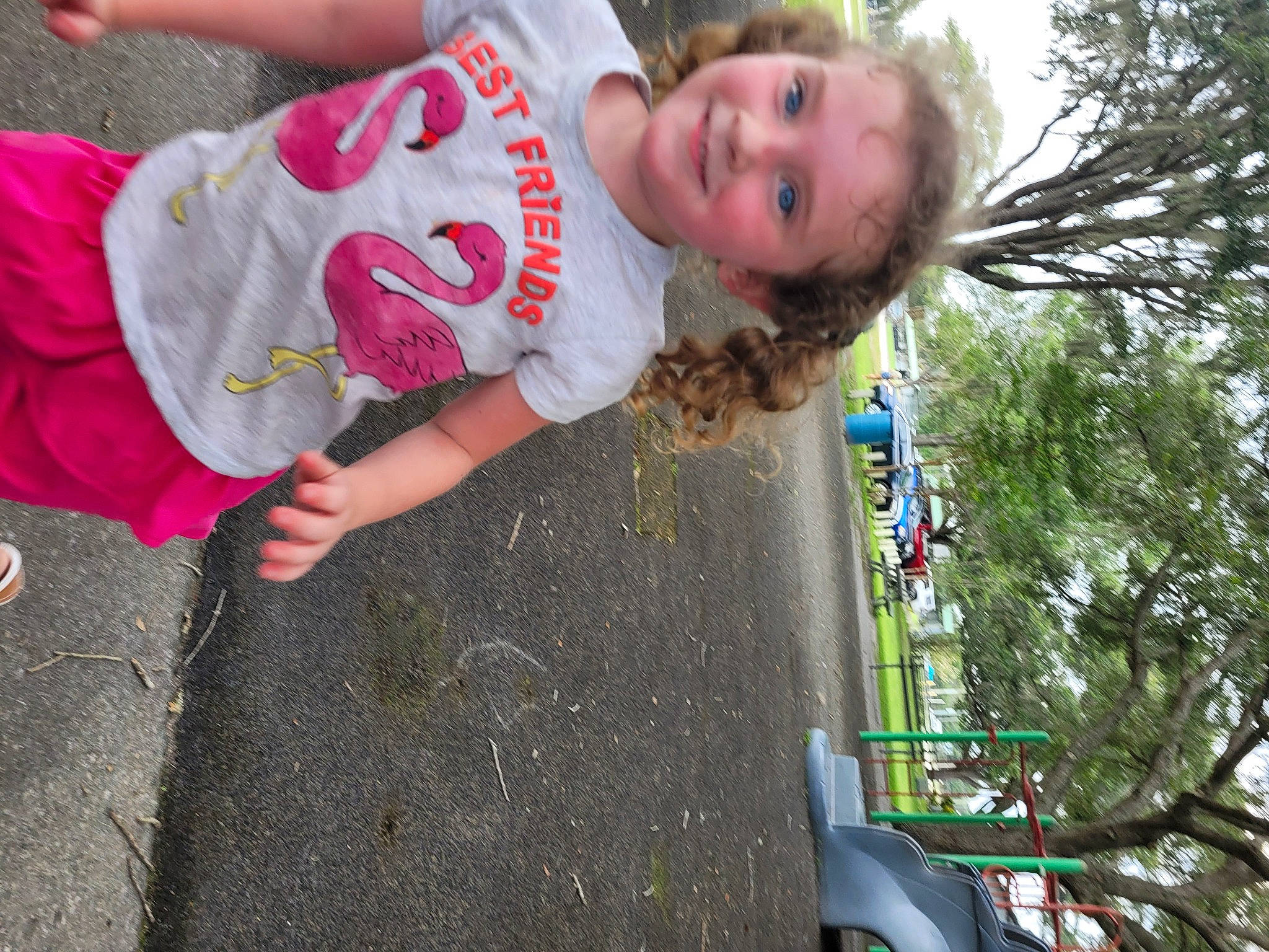 Raelynn is registered to the contest to win money with this photo: asphalt, child, fun, grass, happy, joy, leisure, magenta, person, pink, plant, play, recreation, road_surface, smile, soil, t_shirt, toddler, tree, vacation