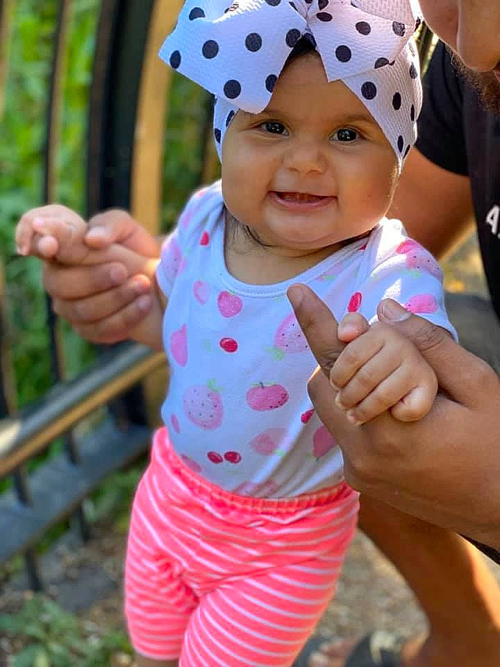 Antonia joined the competition — help win amazing prizes! baby_toddler_clothing, cap, child, event, finger, fun, gesture, green, happy, headgear, headwear, leisure, magenta, people_in_nature, person, pink, recreation, sleeve, smile, summer