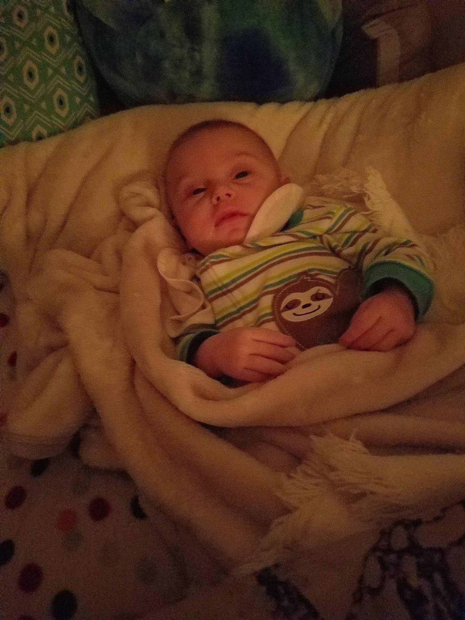 Dennis is registered to the contest to win money with this photo: abdomen, art, baby, cheek, chest, child, comfort, eye, hand, head, human_body, iris, leg, linens, mouth, nose, person, skin, thumb, toddler