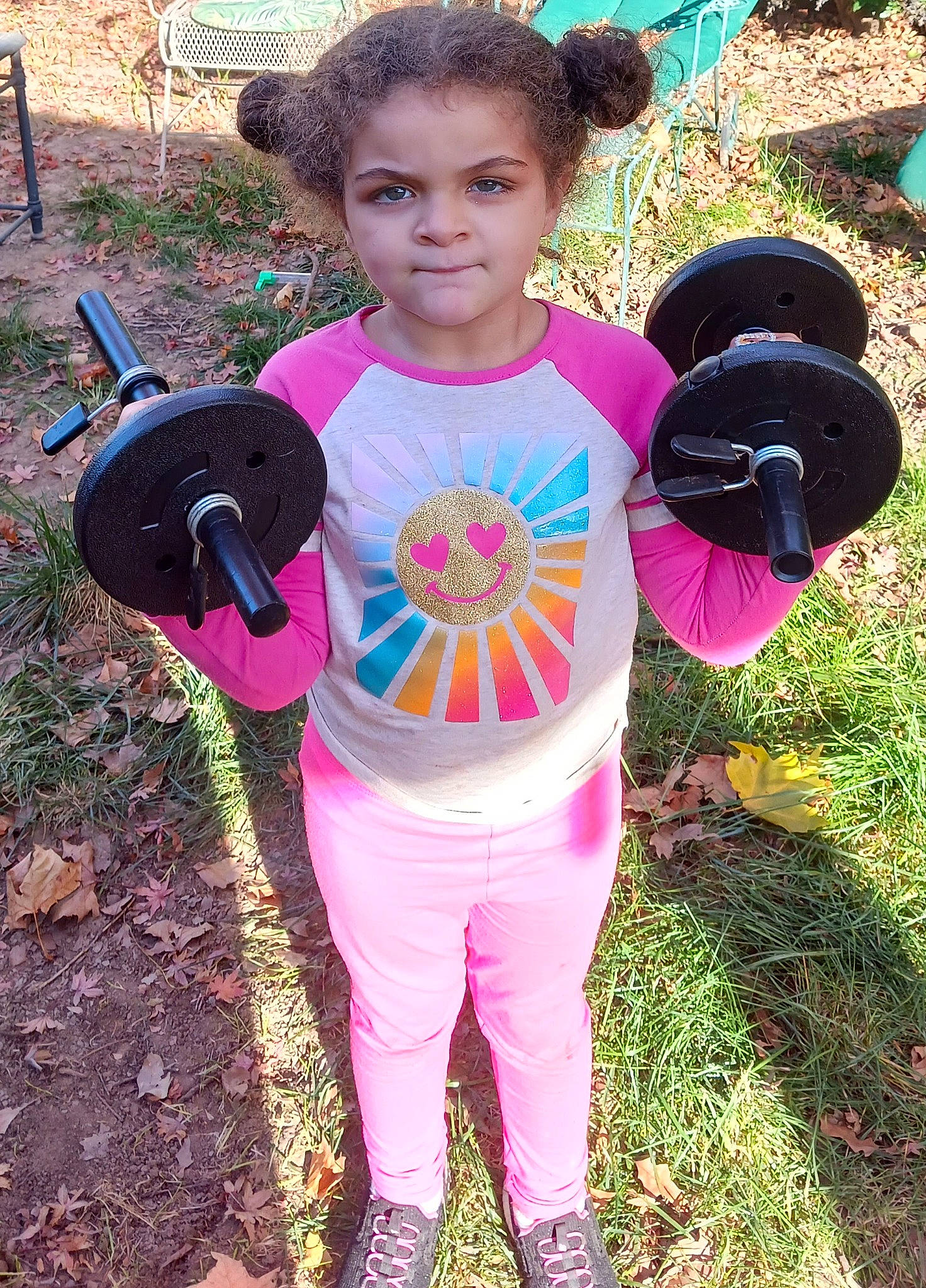 Mariah is registered to the contest to win money with this photo: automotive_wheel_system, baby_toddler_clothing, child, fun, garden, grass, green, happy, leisure, magenta, people_in_nature, person, personal_protective_equipment, pink, play, recreation, sleeve, soil, t_shirt, toddler