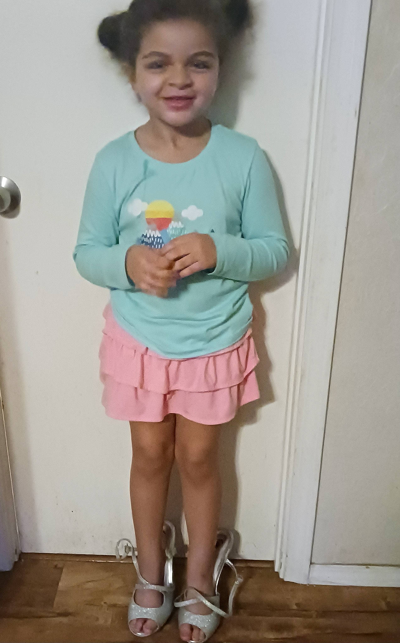 Mariah is registered to the contest to win money with this photo: bottle, drinkware, happy, human_leg, joint, joy, knee, leg, person, pink, plastic_bottle, shorts, shoulder, skin, sleeve, smile, standing, t_shirt, thigh, toddler