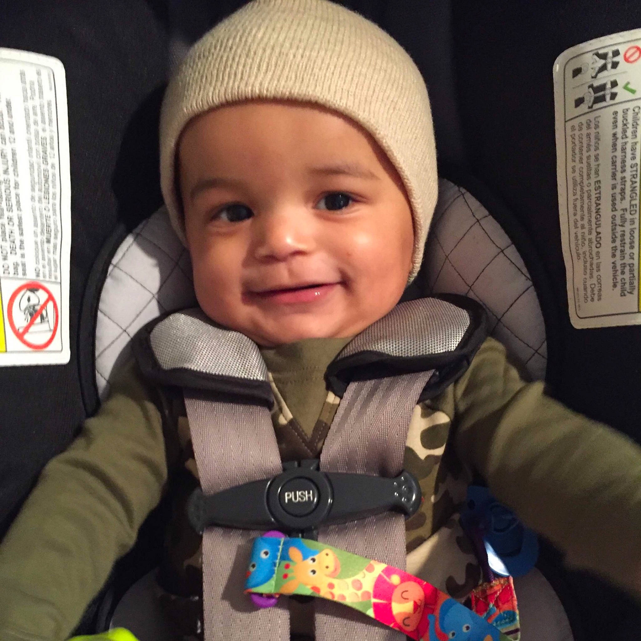 Kamron is registered to the contest to win money with this photo: baby, baby_carriage, baby_in_car_seat, baby_products, beanie, cap, car_seat, cheek, child, cool, happy, headgear, headwear, person, product, seat_belt, smile, toddler