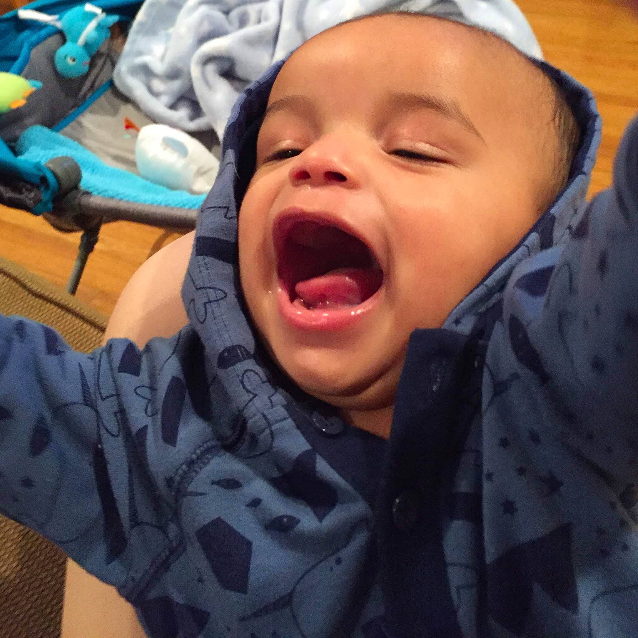 Kamron is registered to the contest to win money with this photo: baby, cheek, child, face, facial_expression, happy, head, headwear, laugh, mouth, nose, person, shout, smile, tongue, yawn