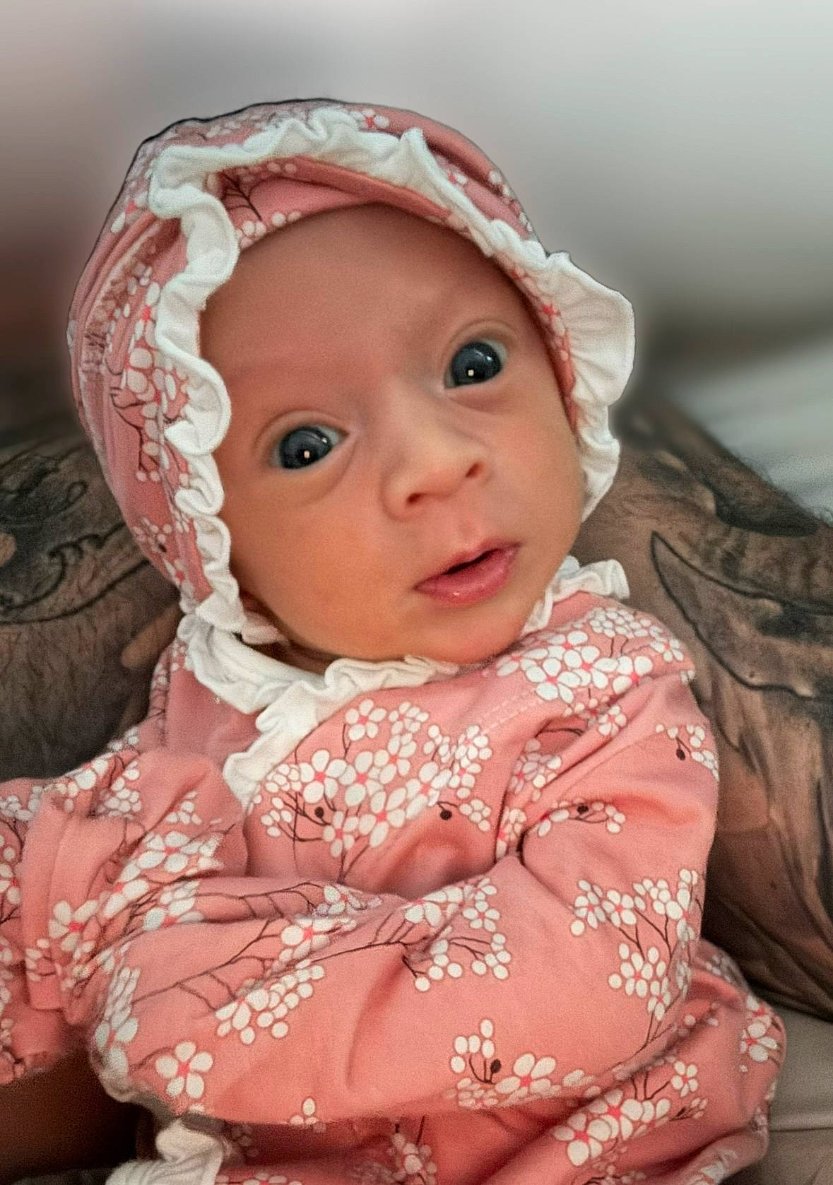 Whitley is registered to the contest to win money with this photo: baby, baby_toddler_clothing, cheek, child, close_up, dress, embellishment, eye, eyelash, face, hair_accessory, happy, headwear, iris, lip, outerwear, pattern, person, pink, skin
