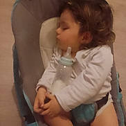 Sacha participe au concours pour gagner de l'argent avec cette photo : baby_bottle, baby_gear, child, clothing, comfort, cute, hands, indoor, infant, long_hair, peaceful, portrait, relaxation, rest, rocker, seated, sleeping, soft_lighting, toddler, young_child