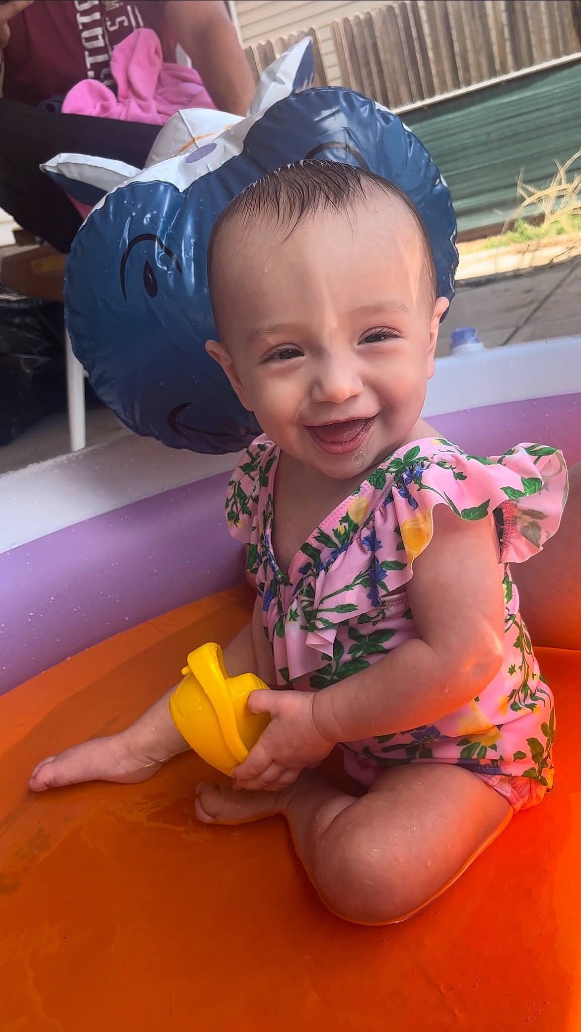 Jazlyn is registered to the contest to win money with this photo: baby, baby_toddler_clothing, cheek, child, finger, flooring, foot, fun, happy, human_leg, joy, leisure, mouth, pattern, person, pink, sitting, skin, smile, thigh