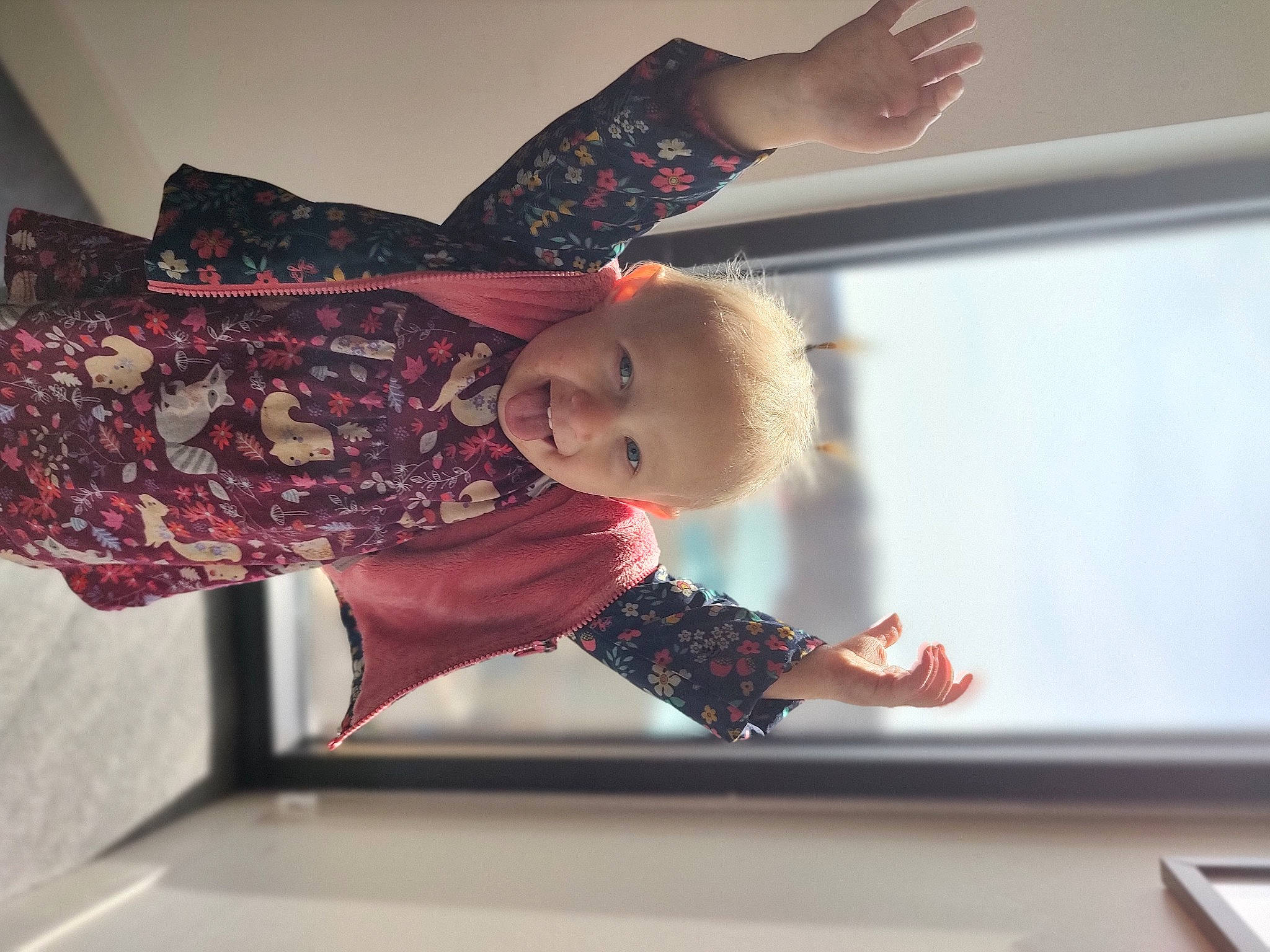 Hadley joined the competition — help win amazing prizes! arm, baby, baby_toddler_clothing, child, elbow, fashion_design, flooring, fun, gesture, happy, joint, magenta, pattern, person, room, sleeve, standing, toddler, visual_arts, window