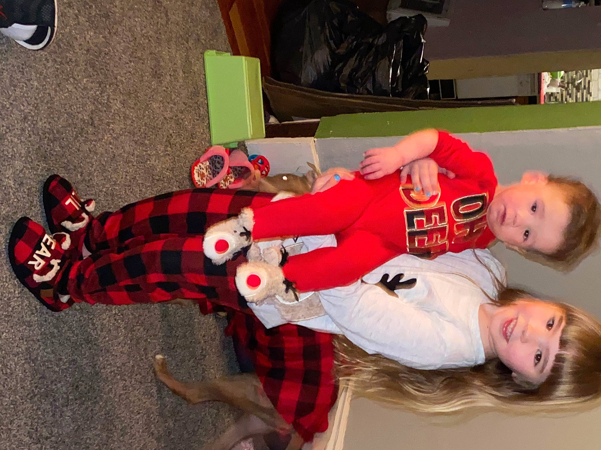 Olivia joined the competition — help win amazing prizes! carmine, event, fictional_character, flooring, fun, holiday, joy, knee, lap, pattern, person, plaid, smile, sock, sports_gear, sports_uniform, tartan, textile, thigh, toddler