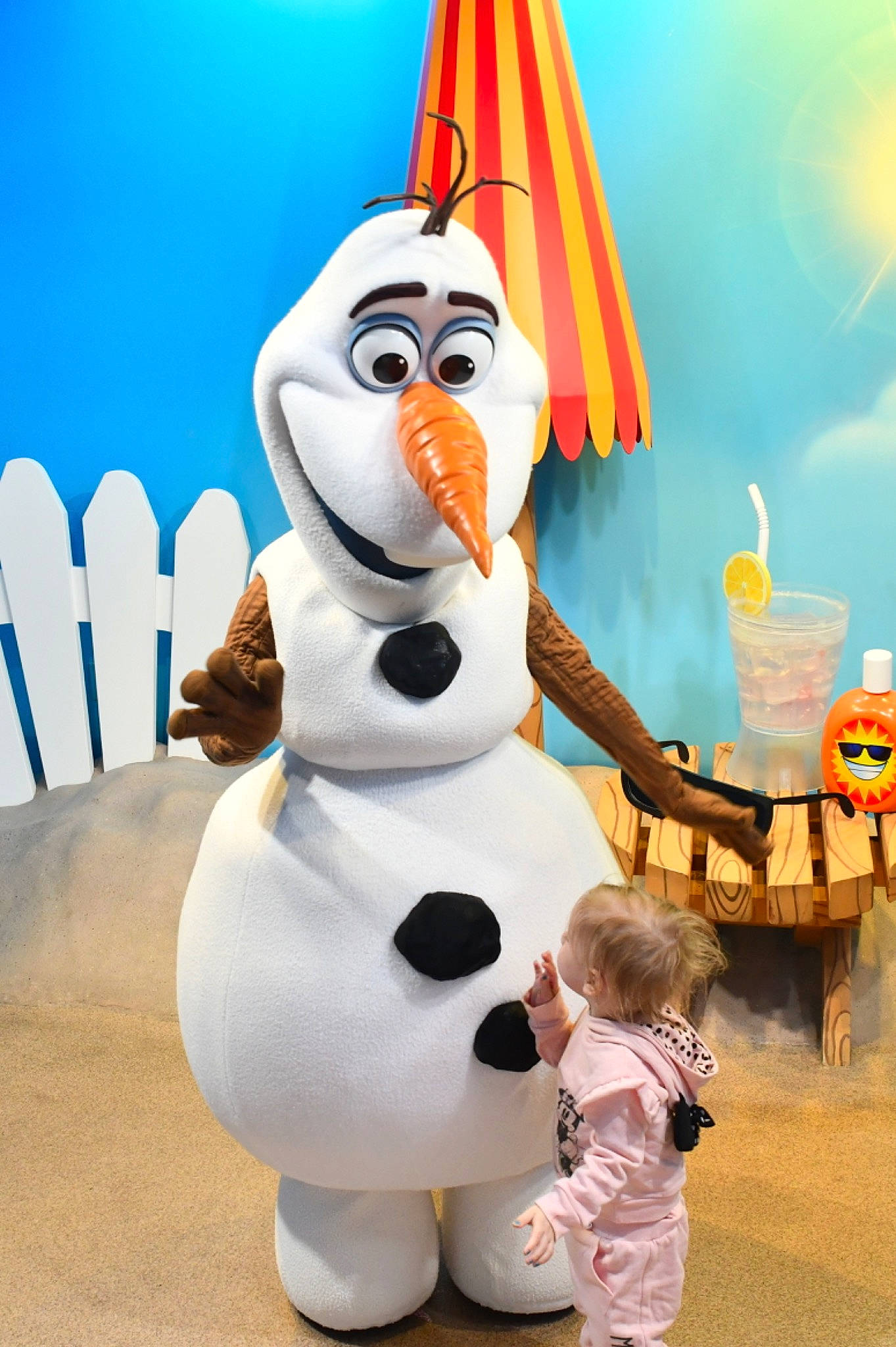 Olivia is registered to the contest to win money with this photo: animated_cartoon, animation, art, entertainment, event, fun, fur, happy, hat, mascot, party_supply, performing_arts, person, recreation, snowman, toddler, winter