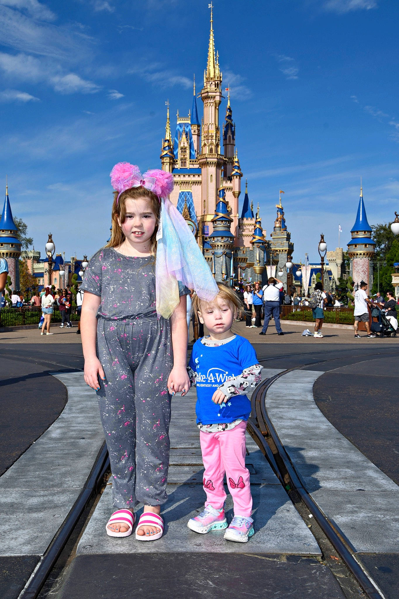 Jocelyn is registered to the contest to win money with this photo: child, city, cloud, event, fun, happy, joy, leisure, nonbuilding_structure, pedestrian, person, pink, recreation, sky, smile, sorrow, spire, street, temple, toddler