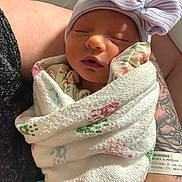 Arianna joined the competition — help win amazing prizes! architecture, baby, blanket, bonnet, building, childbirth, clothing, face, glove, hat, head, newborn, person, photography, portrait, quilt, skin, sleeping, tattoo, towel