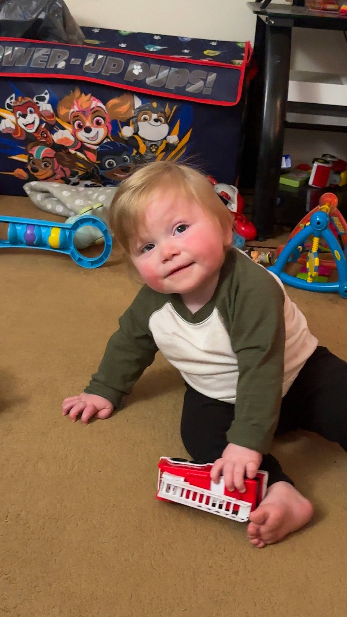 Westen is registered to the contest to win money with this photo: baby, baby_playing_with_toys, baby_products, baby_toddler_clothing, baby_toys, carmine, child, floor, flooring, fun, games, person, play, recreation, room, sitting, smile, sock, t_shirt, toddler