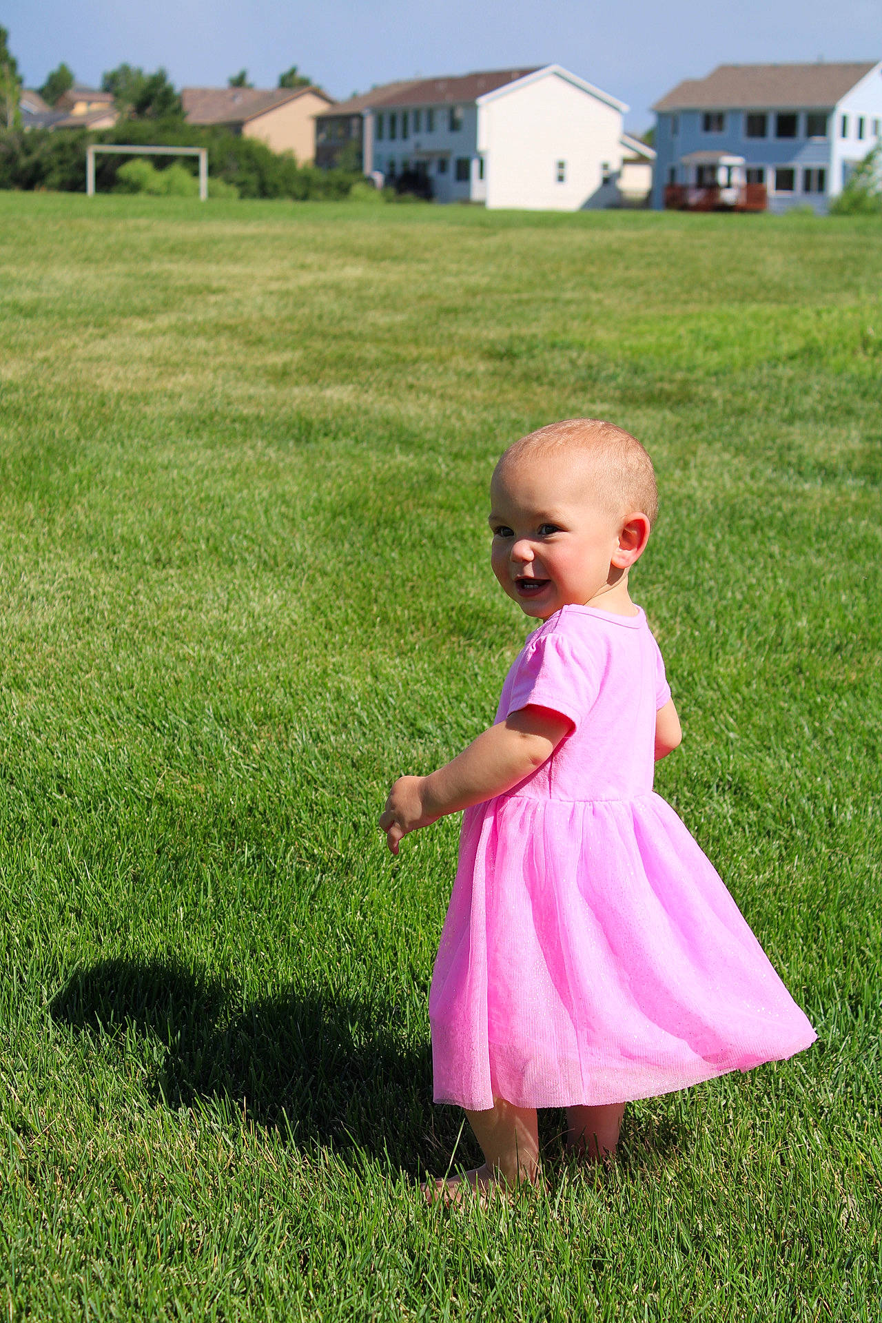 Averie is registered to the contest to win money with this photo: baby, baby_toddler_clothing, day_dress, dress, fun, grass, grass_family, grassland, happy, house, lawn, leisure, meadow, one_piece_garment, people_in_nature, person, pink, plant, recreation, sky