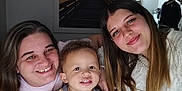 Weston is registered to the contest to win money with this photo: child, toddler, woman, smile, happy, portrait, indoor, family, curly_hair, casual, cozy, people, face, togetherness, warmth, young_child, female, person, head_and_shoulders, relaxed