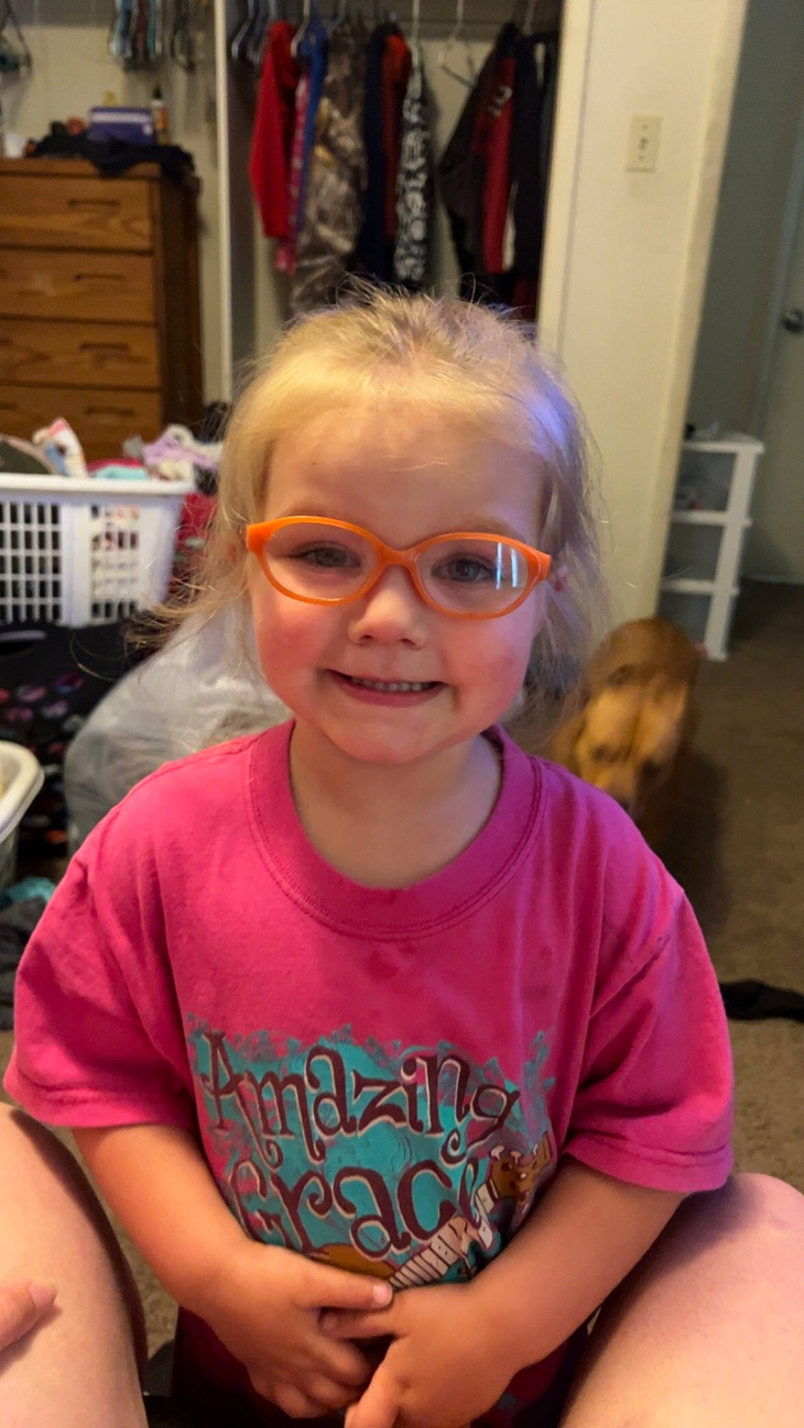 Athena is registered to the contest to win money with this photo: cheek, child, chin, ear, eyewear, forehead, glasses, goggles, hair, happy, iris, joy, mouth, nose, person, pink, skin, smile, sunglasses, t_shirt