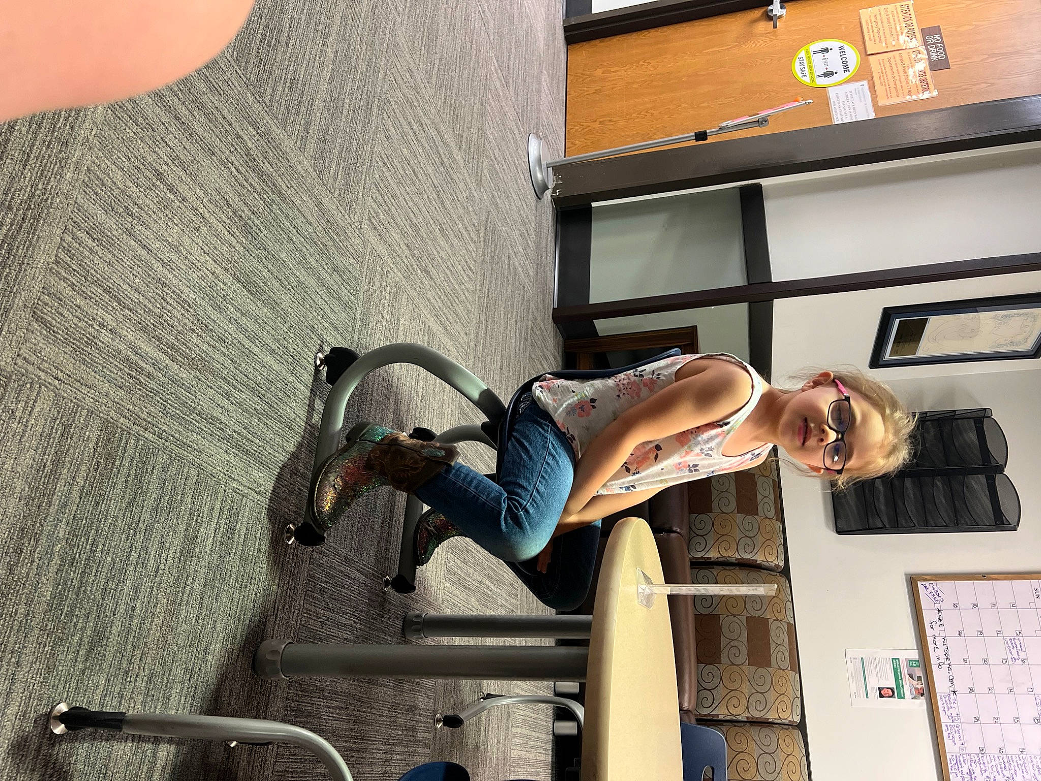 Rosaetta is registered to the contest to win money with this photo: building, elbow, eyewear, facade, human_leg, knee, machine, person, room, shorts, thigh, wall, window, wood