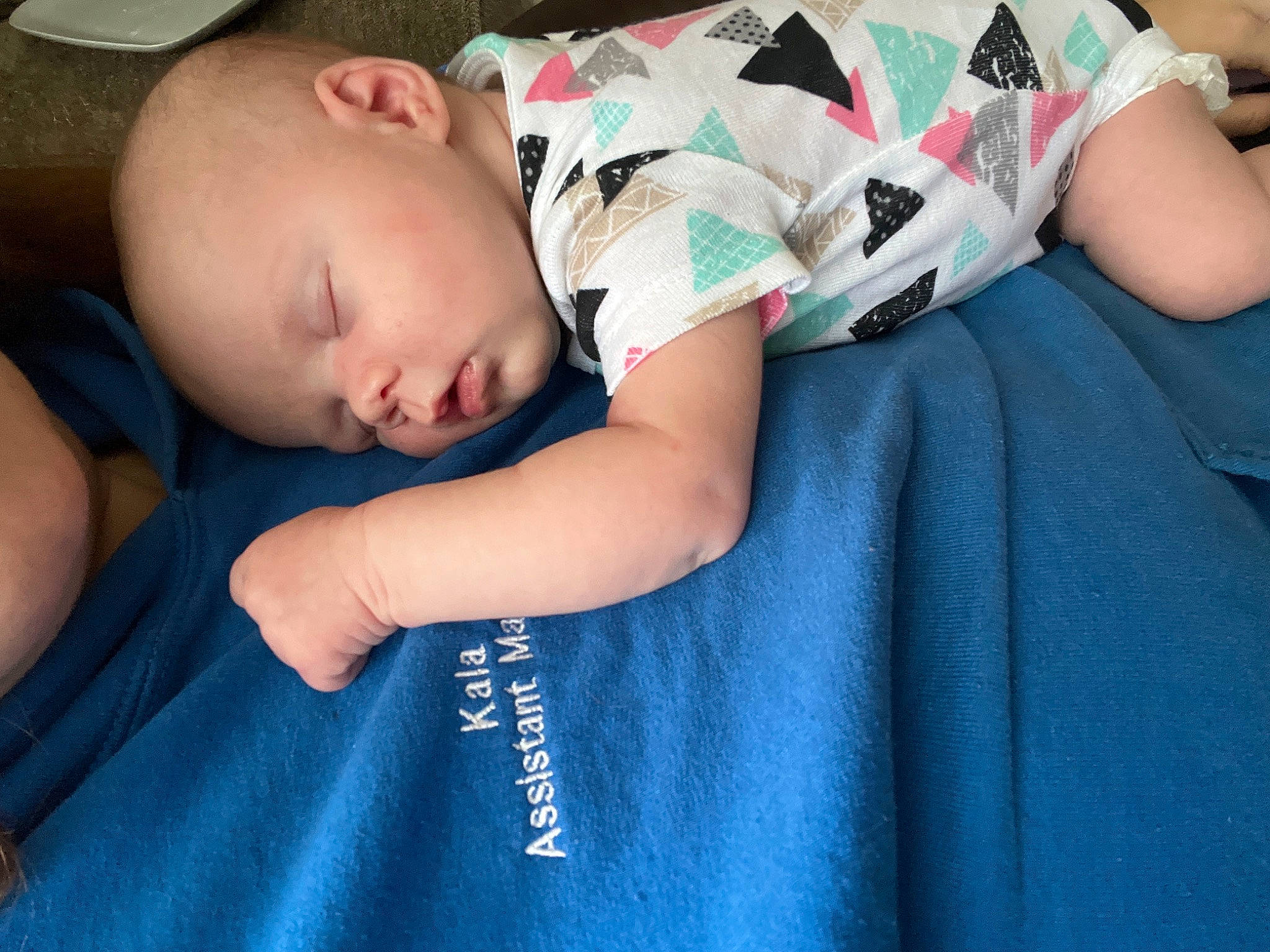 Rowen is registered to the contest to win money with this photo: baby, baby_products, baby_sleeping, baby_toddler_clothing, bedtime, cheek, child, comfort, elbow, electric_blue, human_leg, linens, nap, pattern, person, room, sitting, skin, sleeve, t_shirt