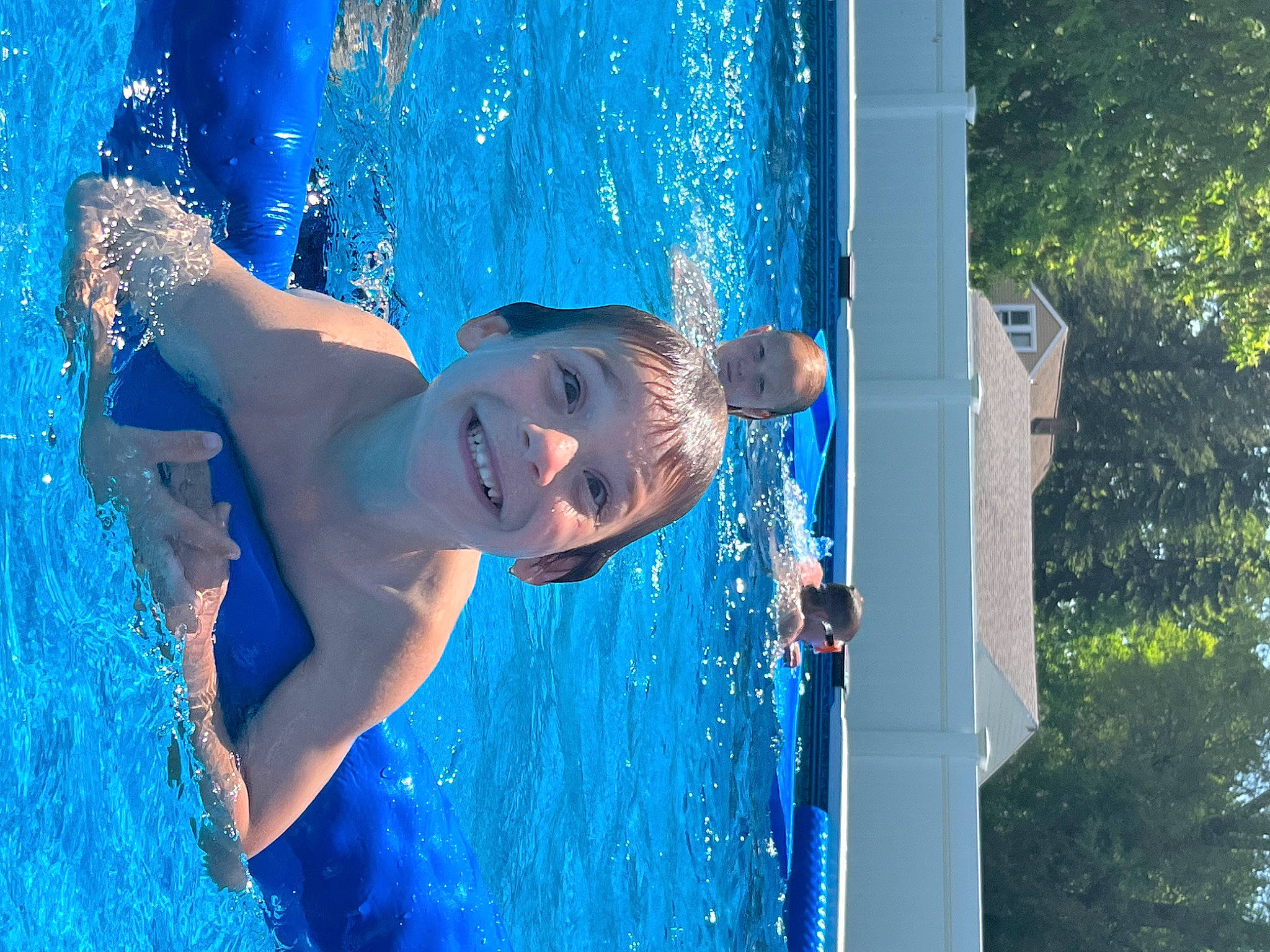 Luchiano is registered to the contest to win money with this photo: bathing, blue, chest, child, electric_blue, fun, happy, joy, lake, leisure, people_in_nature, person, play, recreation, smile, standing, sunlight, swimming_pool, toddler, tree