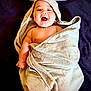 adorable, baby, blanket, bunny_ears, child, cozy, cute, expression, face, happy, head, infant, lying_down, portrait, skin, smiling, soft, towel, warm, wrapped