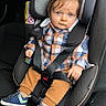 Cesar a rejoint le concours — aidez-le/la à gagner de superbes lots ! baby, child, car_seat, blue_eyes, plaid_shirt, mustard_pants, sneakers, seatbelt, sitting, infant, car_interior, clothing, cute, portrait, young_child, safety, seat, straps, looking_at_camera, casual_wear