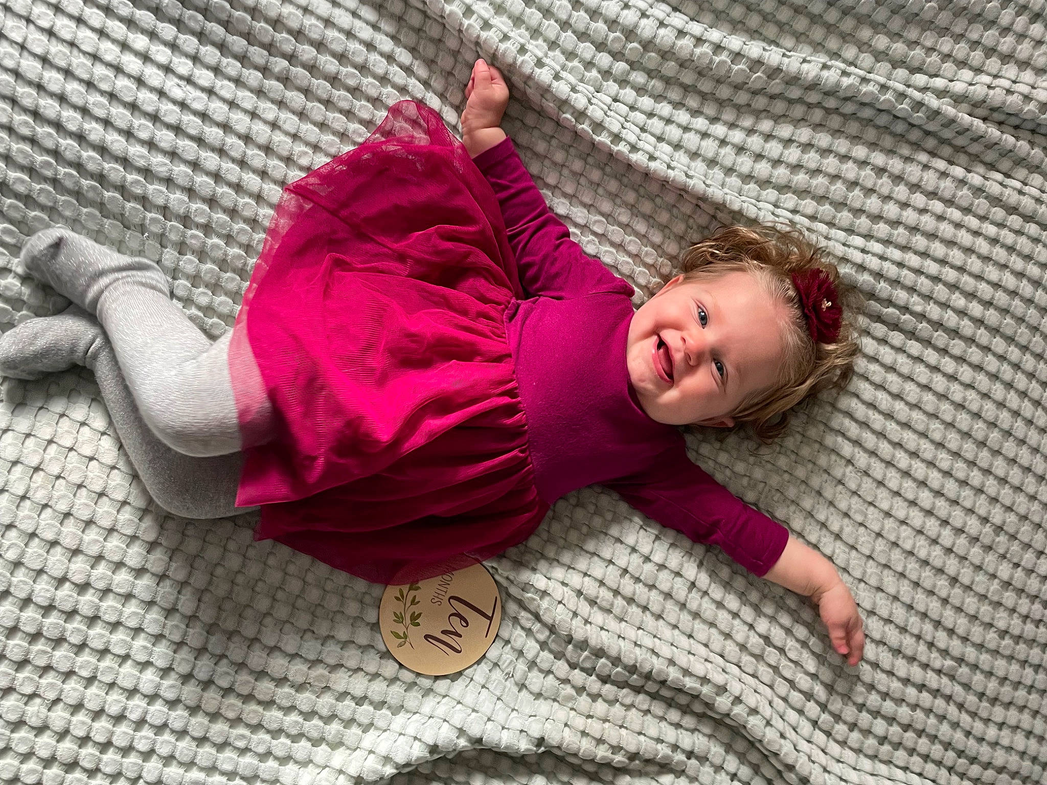 Livia is registered to the contest to win money with this photo: baby, baby_products, baby_safety, baby_toddler_clothing, cheek, child, comfort, floor, flooring, joy, linens, magenta, mesh, pattern, person, pink, purple, sitting, skin, sleeve