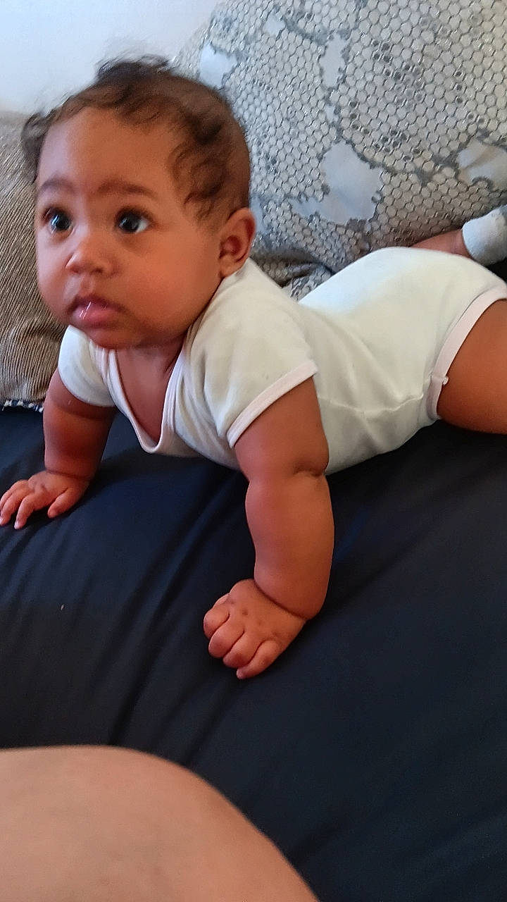 Sadie joined the competition — help win amazing prizes! baby, baby_toddler_clothing, cheek, child, comfort, elbow, face, finger, floor, flooring, head, human_body, human_leg, joint, leg, neck, person, skin, sleeve, surprise