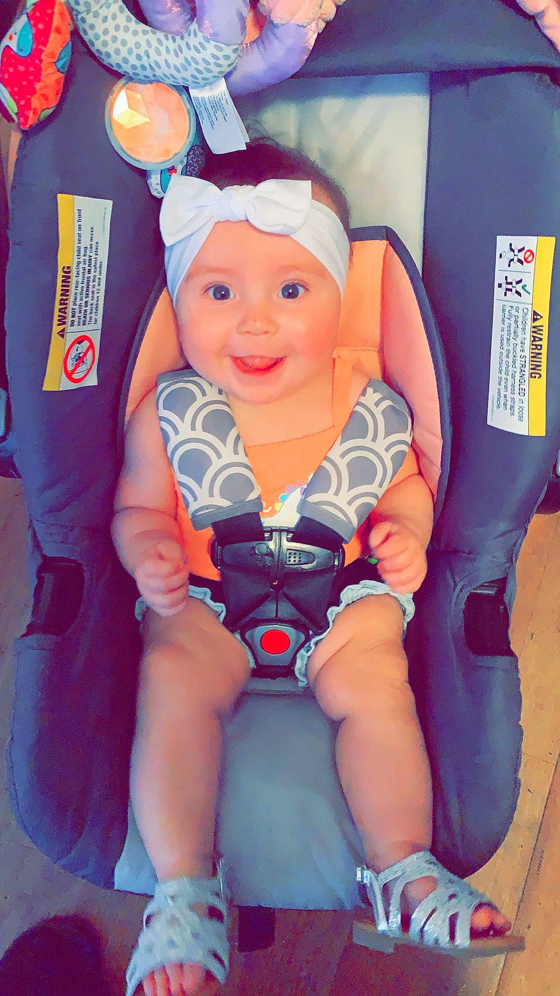 Juliana is registered to the contest to win money with this photo: baby, baby_products, baby_toddler_clothing, blue, chair, child, comfort, electric_blue, fun, happy, headwear, joy, orange, person, personal_protective_equipment, pink, product, purple, service, sitting