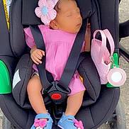 Maeva participe au concours pour gagner de l'argent avec cette photo : baby, car_seat, stroller, pink_dress, headband, flower, sleeping, baby_shoes, blue_shoes, pink_bow, outdoor, pavement, baby_accessories, child, infant, cute, resting, small_purse, seatbelt, toddler