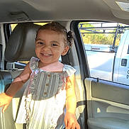Trinity joined the competition — help win amazing prizes! child, toddler, smiling, inside_car, sunlight, curly_hair, striped_top, frills, happy, seat, car_door, window, shadow, daylight, person, portrait, clothing, young_child, cute, bright