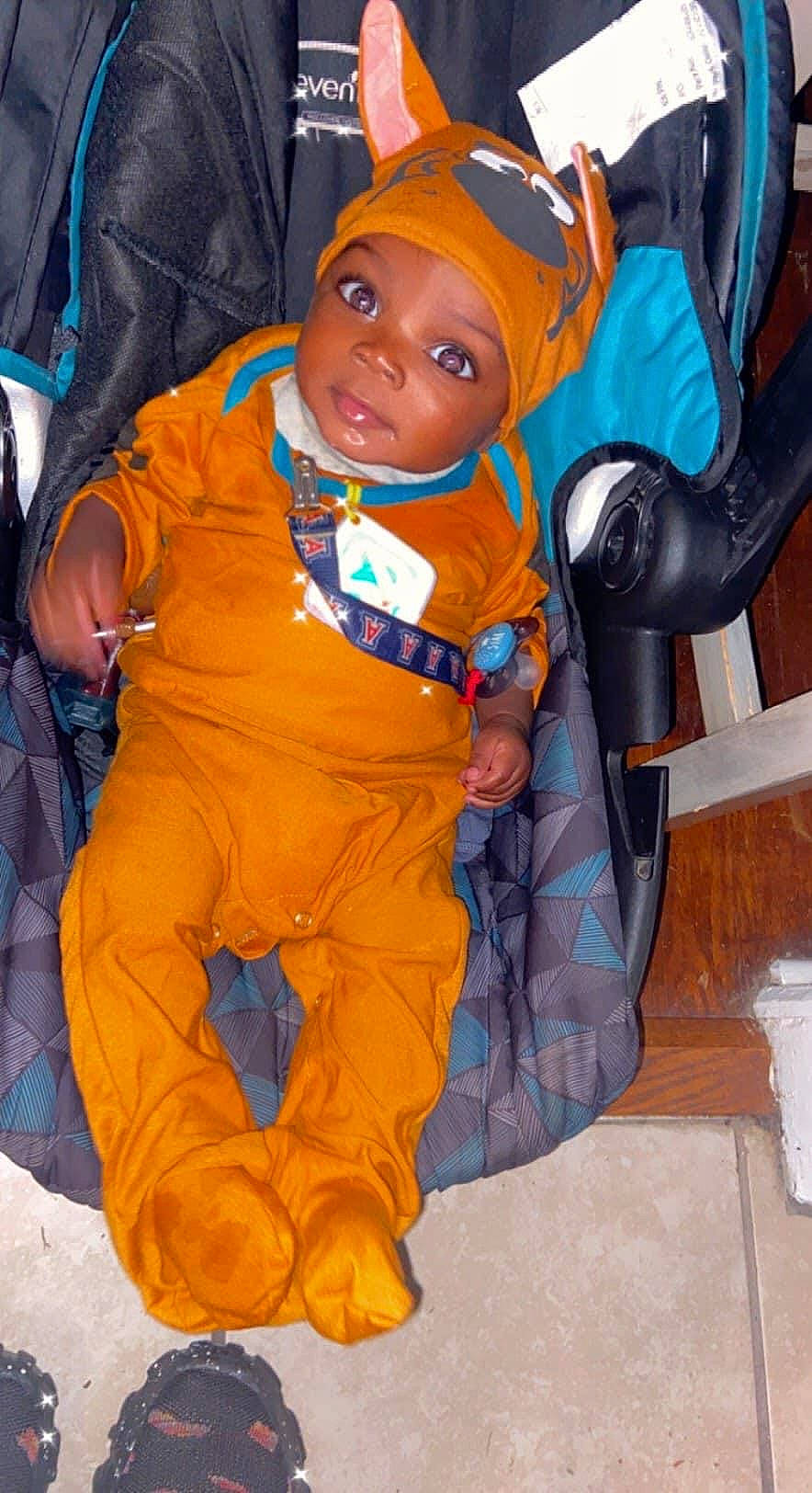 Messiah joined the competition — help win amazing prizes! baby, baby_products, bag, baseball_cap, cap, car_seat, child, costume, electric_blue, fictional_character, fun, hat, headgear, headwear, lifejacket, orange, person, personal_protective_equipment, sitting, toddler