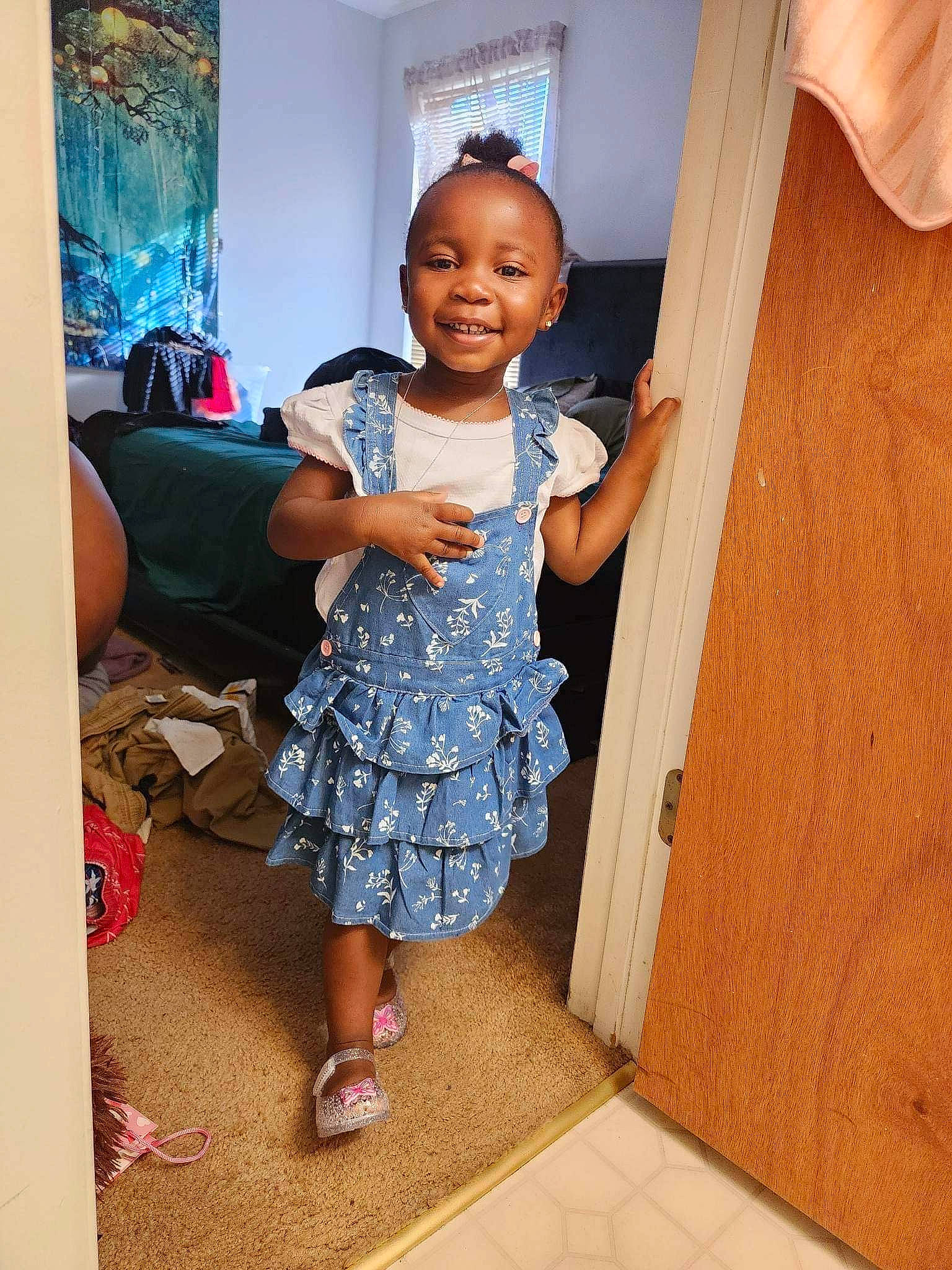 Amayah joined the competition — help win amazing prizes! baby_toddler_clothing, child, door, floor, flooring, fun, happy, hardwood, joy, magenta, pattern, person, purple, sandal, shoulder, sleeve, smile, t_shirt, textile, toddler