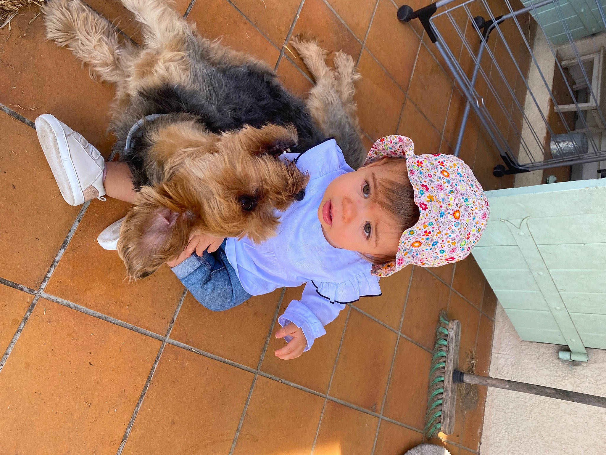 Nella participe au concours pour gagner de l'argent avec cette photo : baby, baby_toddler_clothing, child, comfort, companion_dog, flooring, fun, fur, happy, hat, headwear, leisure, person, toddler, vacation, wood