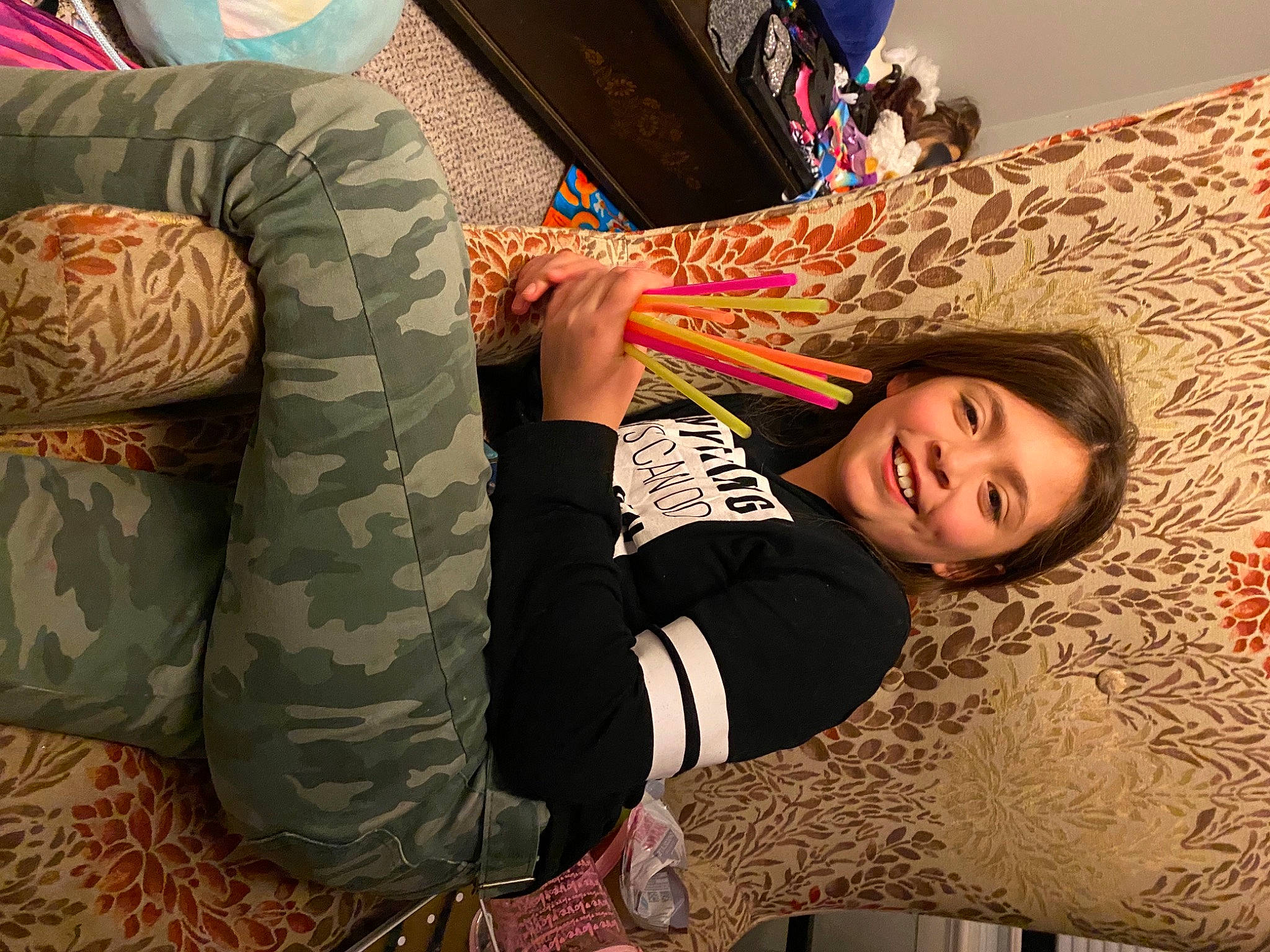 Brooklyn is registered to the contest to win money with this photo: camouflage, comfort, cool, elbow, finger, flooring, fun, hairstyle, happy, human_body, human_leg, joint, joy, knee, leg, military_camouflage, pattern, person, sleeve, smile