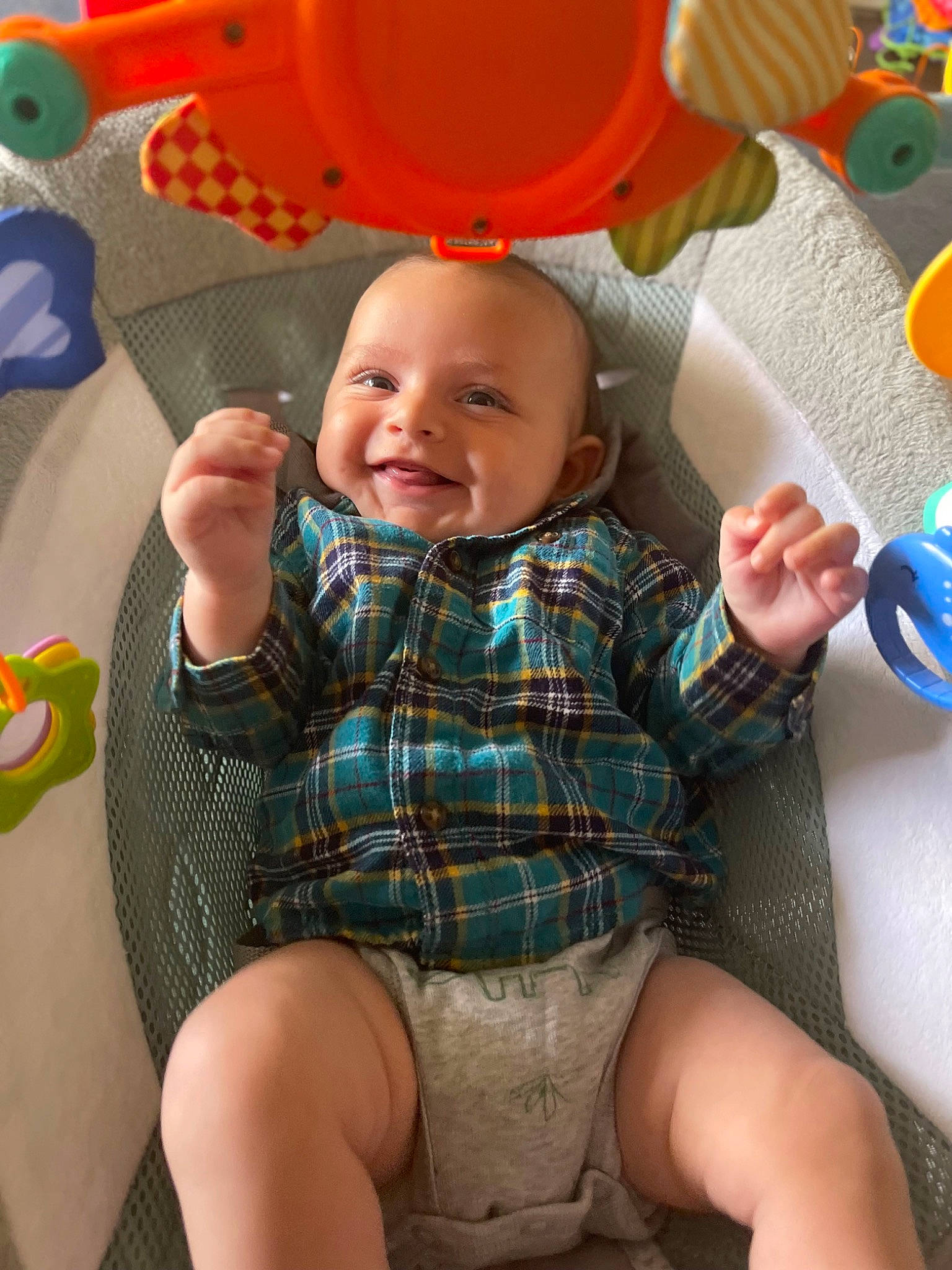 Ezra is registered to the contest to win money with this photo: baby, baby_toddler_clothing, blue, child, comfort, design, finger, fun, happy, human_body, joy, mouth, organ, pattern, people, person, skin, smile, textile, thigh