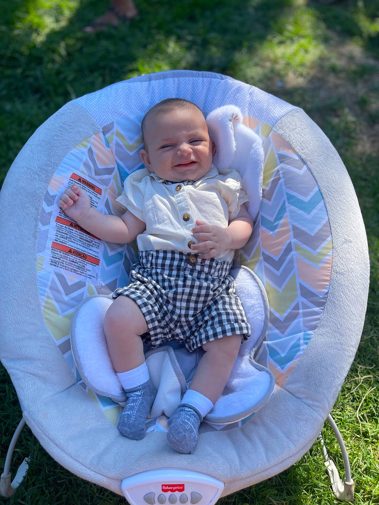 Ezra is registered to the contest to win money with this photo: azure, baby, baby_products, baby_toddler_clothing, chair, child, circle, comfort, electric_blue, event, fun, grass, happy, lap, leisure, pattern, person, recreation, shorts, sitting