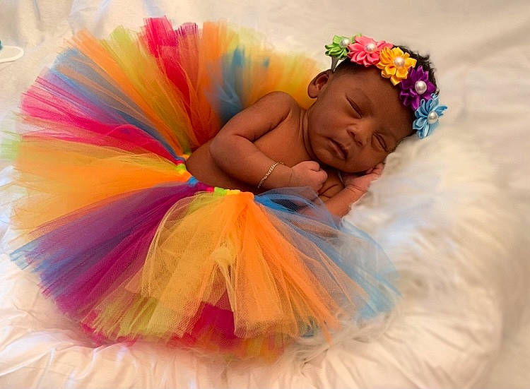Avani joined the competition — help win amazing prizes! baby, baby_toddler_clothing, child, costume, costume_accessory, event, fashion_accessory, feather, fun, hair_accessory, happy, headband, headpiece, headwear, leisure, magenta, peach, person, petal, pink