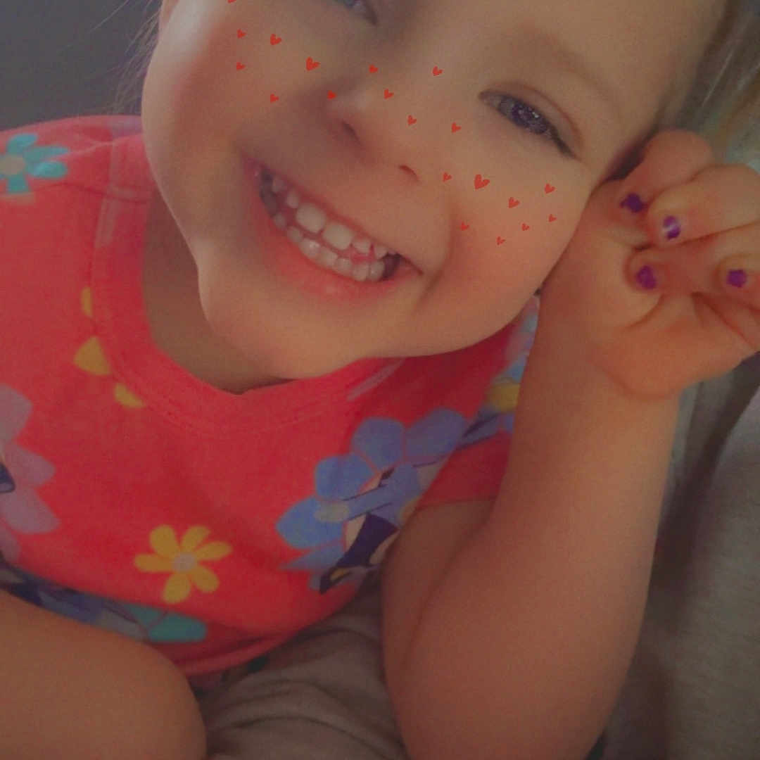 Kaycee is registered to the contest to win money with this photo: casual, cheerful, child, closeup, colorful, cute, face, floral_pattern, freckles, happy, heart_shapes, indoor, nail_polish, person, pink_shirt, portrait, skin, smiling, toddler, young