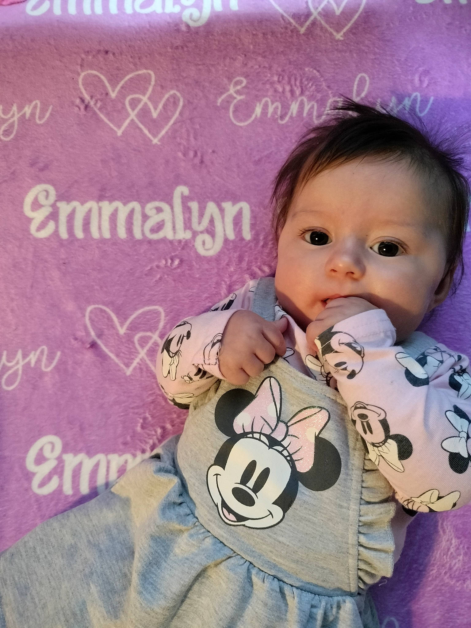 Emmalyn is registered to the contest to win money with this photo: baby, baby_products, baby_safety, baby_toddler_clothing, cheek, child, font, happy, head, human, linens, magenta, pattern, person, photo_caption, pink, product, skin, sleeve, textile