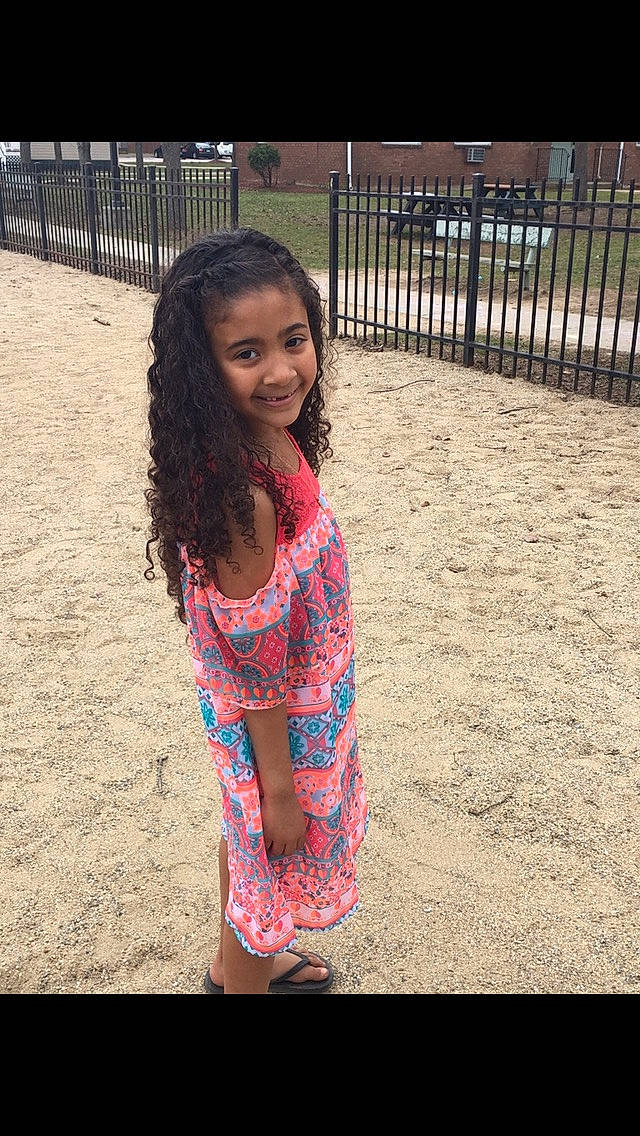 Amyah joined the competition — help win amazing prizes! beauty, black_hair, child, dress, face, facial_expression, happy, long_hair, pattern, person, photography, pink, play, shoe, shoulder, sitting, skin, smile, summer, toddler