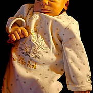 Andrea participe au concours pour gagner de l'argent avec cette photo : baby, infant, onesie, winnie_the_pooh, clothing, star_pattern, cute, portrait, face, hand, newborn, soft_lighting, expression, child, young, sleepwear, cozy, looking_away, skin, indoor