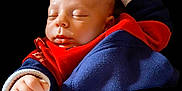 Andrea participe au concours pour gagner de l'argent avec cette photo : baby, sleeping, infant, face, hand, clothing, red, blue, fist, cozy, cute, peaceful, child, portrait, newborn, soft, skin, young, resting, apparel
