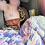baby, newborn, car_seat, hat, pom_poms, blanket, sleeping, clothing, infant, child, leopard_print, pink, purple, white, soft_texture, cute, bundle, cozy, indoors, person