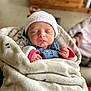 newborn, baby, sleeping, blanket, hat, cozy, infant, cute, wrapped, soft_focus, indoors, peaceful, child, portrait, clothing, warm, small_hands, resting, face, headwear