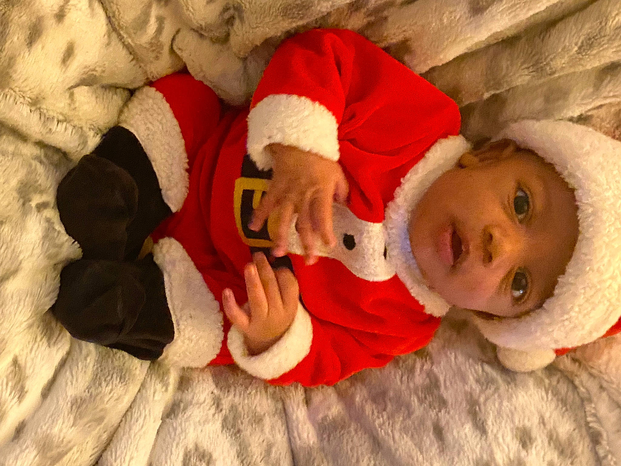 Amenadiel joined the competition — help win amazing prizes! baby, baby_toddler_clothing, carmine, child, comfort, flooring, fun, happy, headwear, lap, linens, mammal, orange, person, room, santa_claus, sleeve, sock, textile, toddler