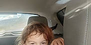 Mavrik joined the competition — help win amazing prizes! child, car_interior, tongue_out, playful, cheeky, window, seat, headrest, hair, black_shirt, hand, smiling, seatbelt, daylight, vehicle, portrait, person, fun, young, happy